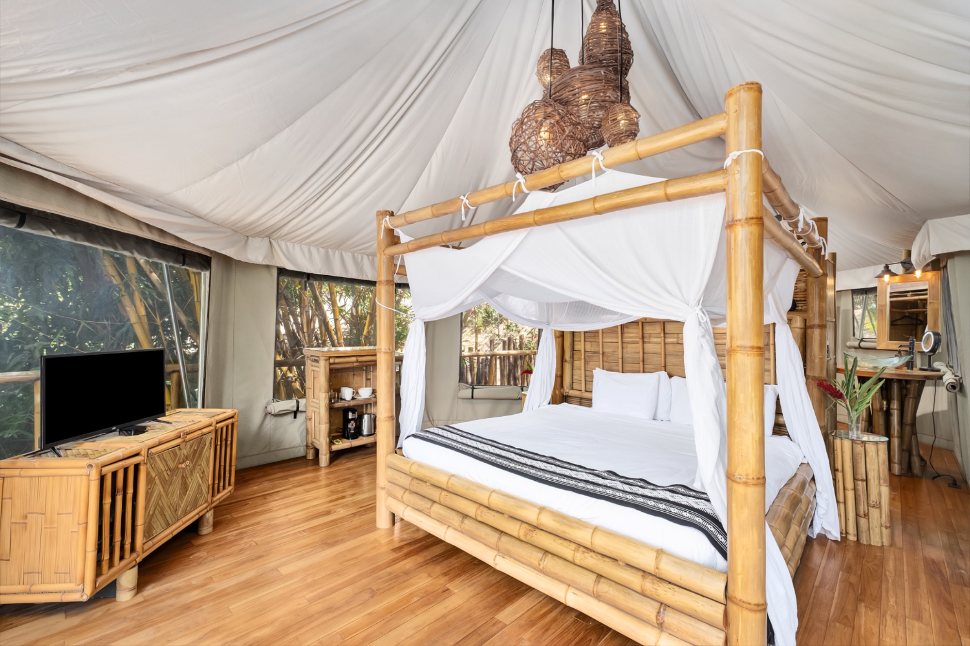Bamboo tent interior with canopy bed